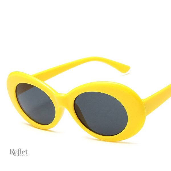 Lunettes de soleil femme style vintage avec contour blanc
