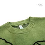 Pull vintage avec motif dinosaure