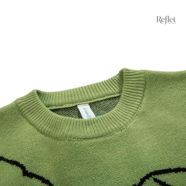 Pull vintage avec motif dinosaure