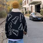Pull classique avec design vintage de dinosaure