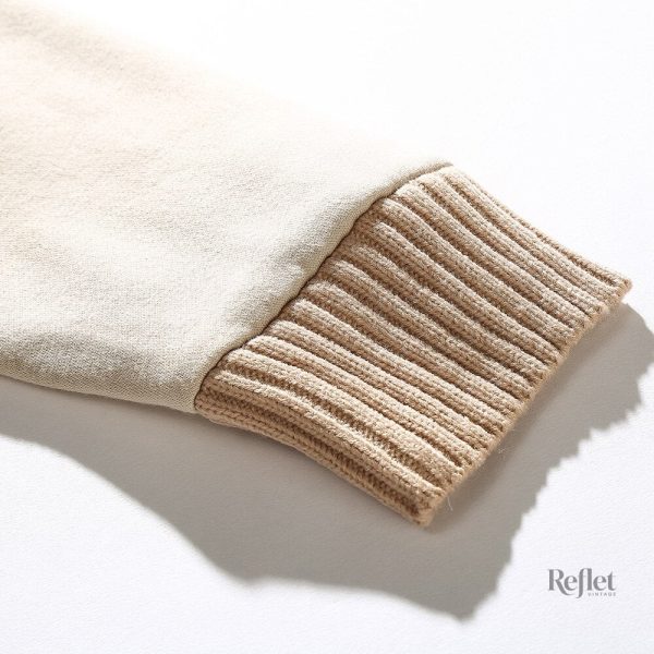 Tricot vintage beige, incontournable pour une garde-robe féminine