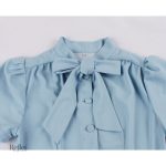 Robe années 60, coupe intemporelle avec nœud